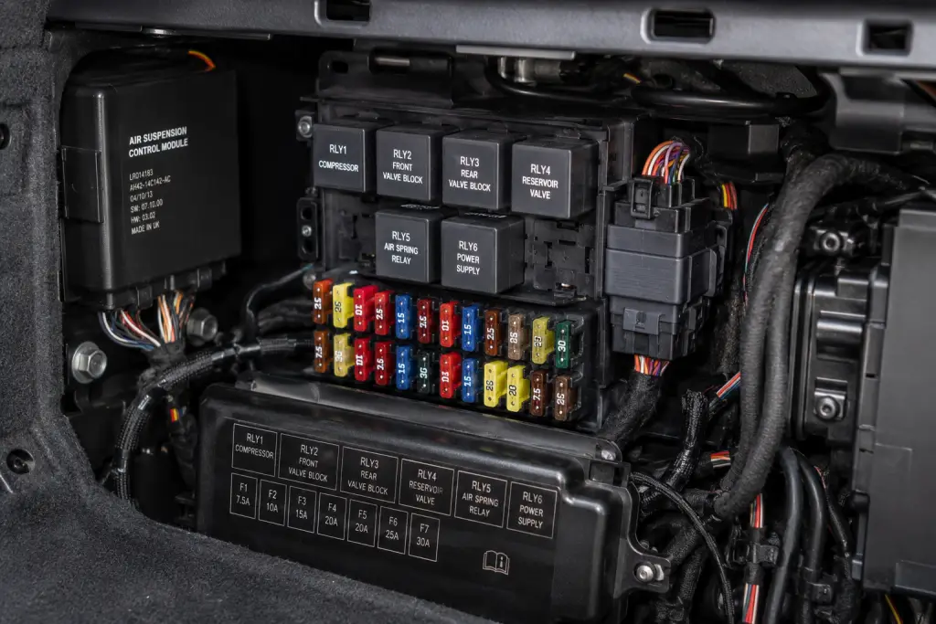 Air suspension relays and electrical components installed inside a luxury SUV using quality air suspension parts South Africa