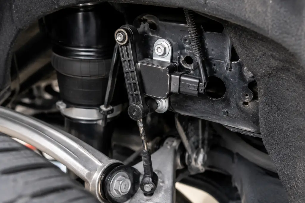 Air suspension ride height sensor installed inside a luxury SUV suspension system using quality air suspension parts for sale South Africa