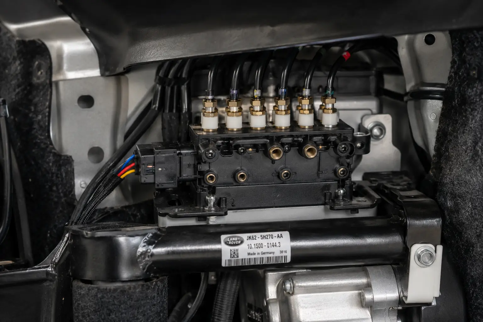 Air suspension valve block installed inside a luxury SUV air suspension system